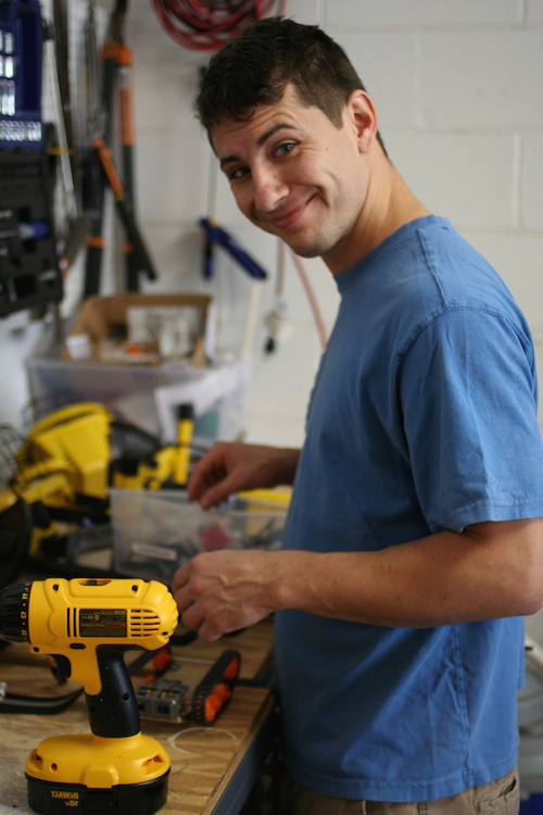 Me working on a tracked vehicle in the garage